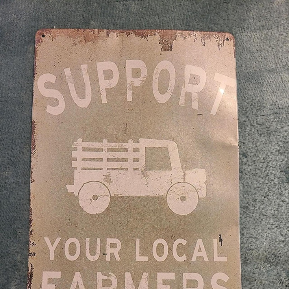 Support Your Local Farmer metal sign 8 inches by 12 inches.'